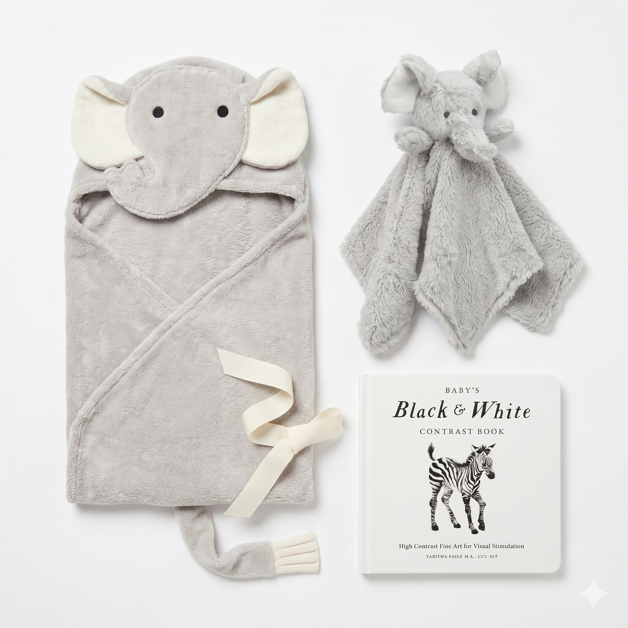 Gender neutral elephant baby gift set with hooded towel, plush lovey, and black and white contrast book