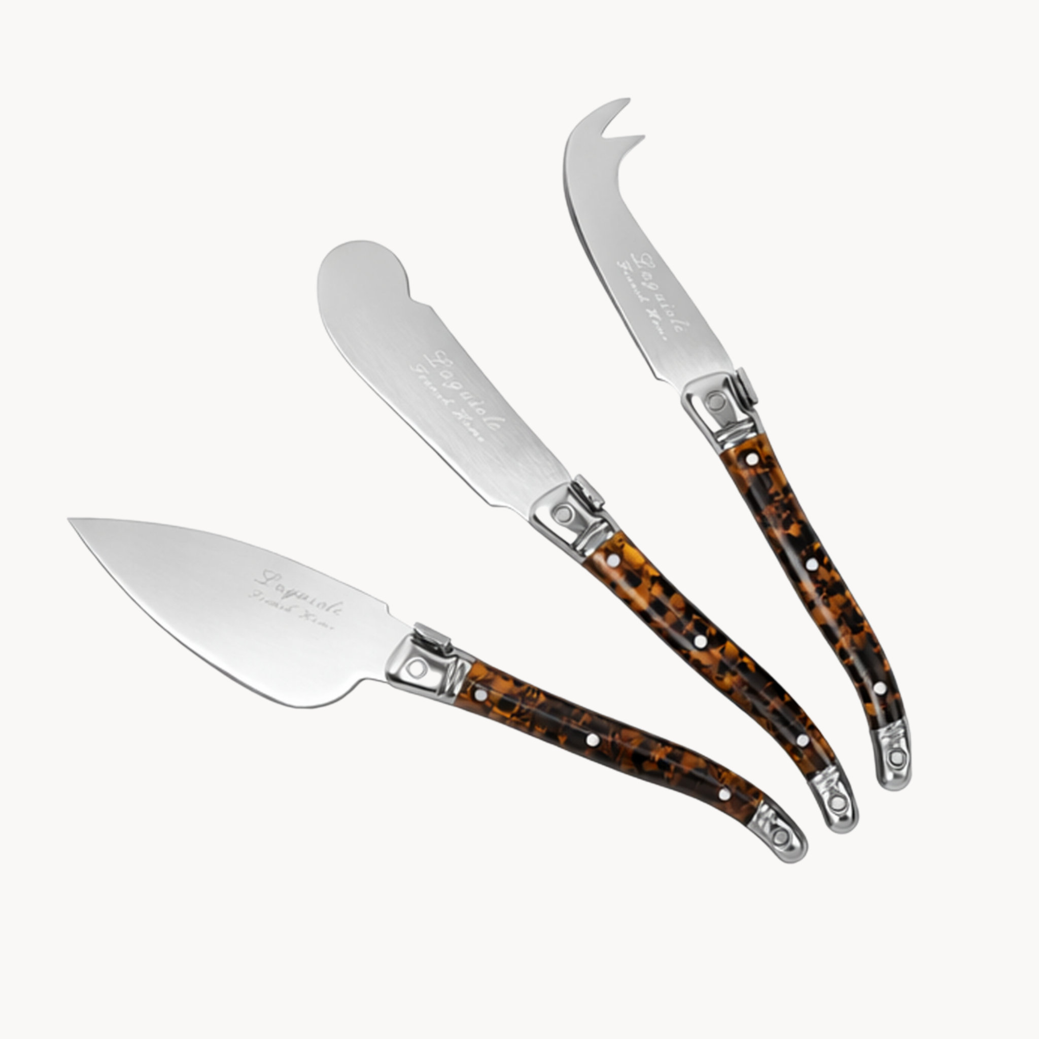 tortoise shell cheese knife set with stainless steel blades and warm brown patterned handles
