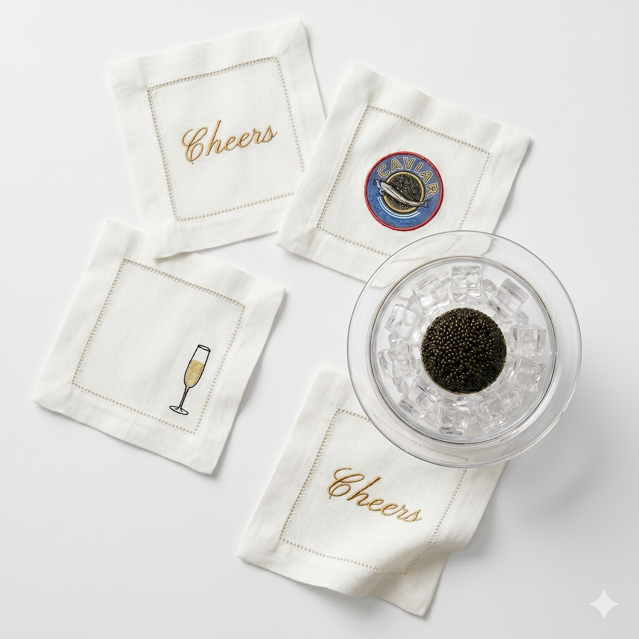 Caviar entertaining set with embroidered cocktail napkins and caviar served over ice