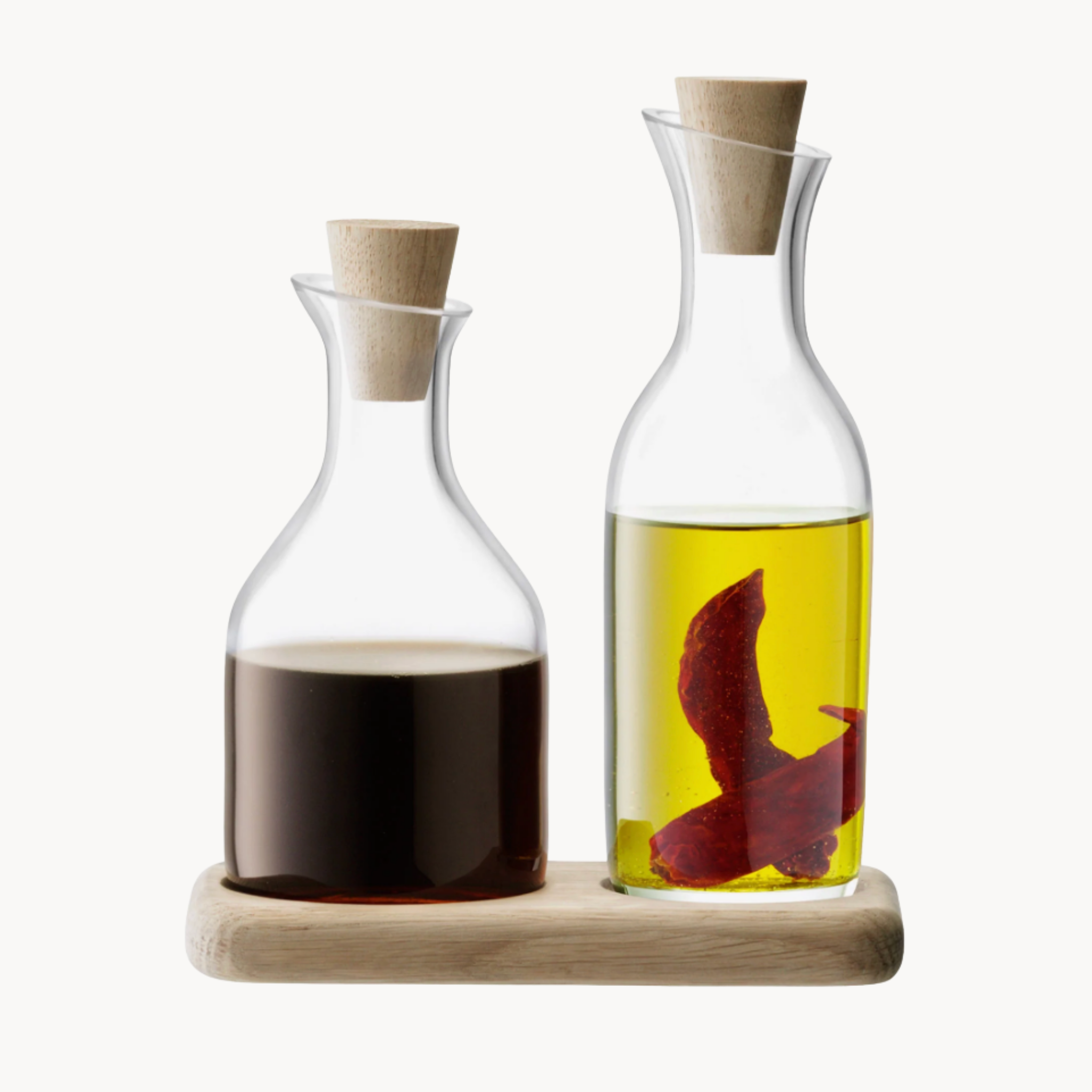 clear glass oil and vinegar set with natural oak base for kitchen countertop or table serving
