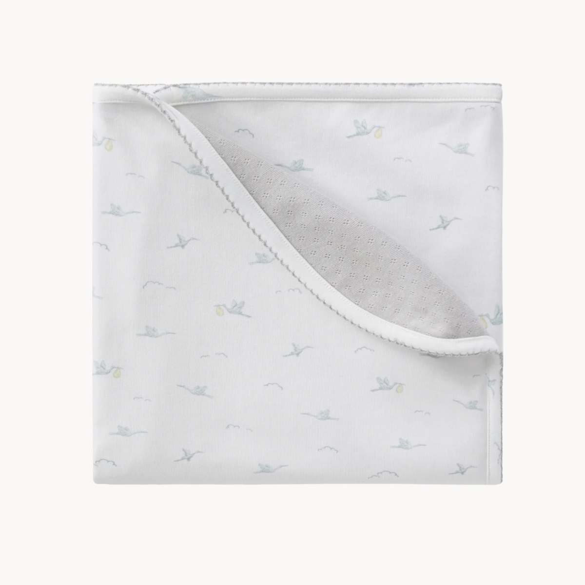 stork reversible baby blanket with soft fabric and coordinating patterns for nursery and everyday use